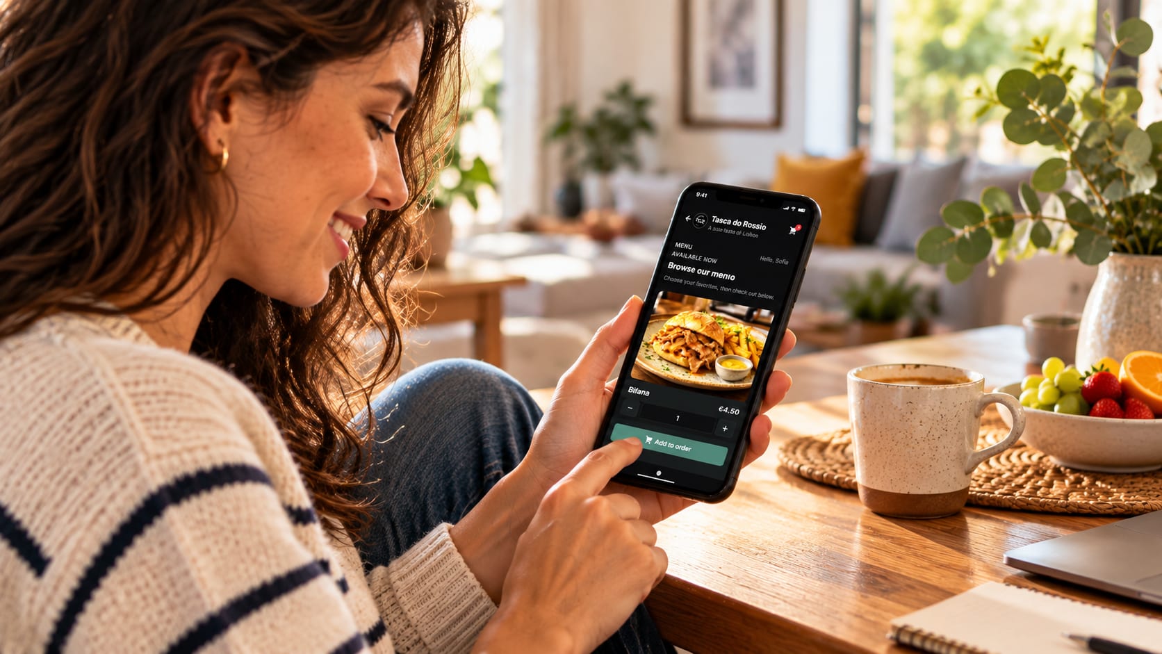 A customer ordering a bifana from her phone at home